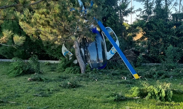 Helikopter iniş sırasında çarptığı ağaçların arasında kaldı Helikopter iniş sırasında çarptığı ağaçların arasında kaldı